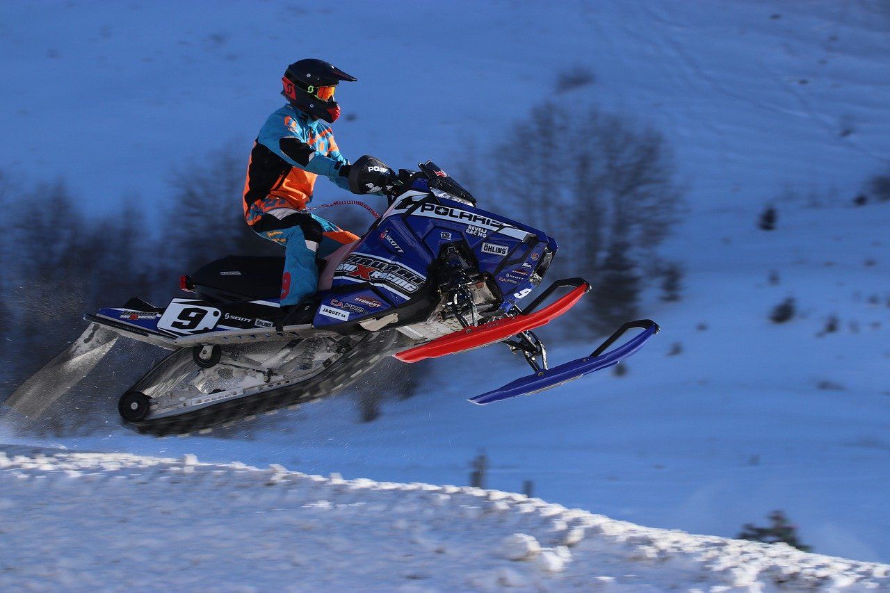 Blue And Red Polaris Snowmobile