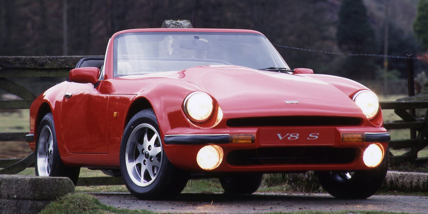 A red V8 S, lights on