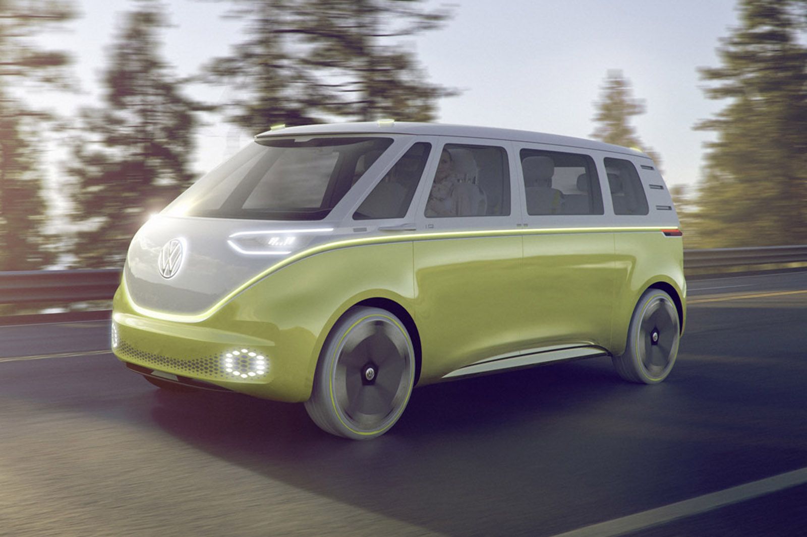 Volkswagen ID Buzz driving on the road with lights on
