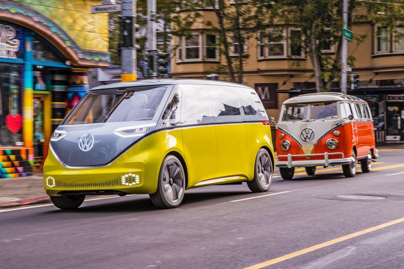 VW ID Buzz and Type 2 driving together on road