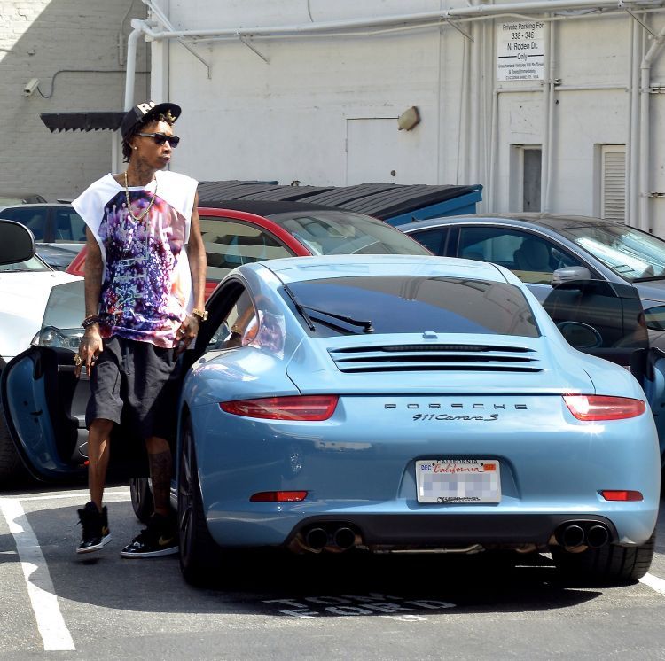 Rapper Wiz Khalifa with his Sky-Blue Porsche 911