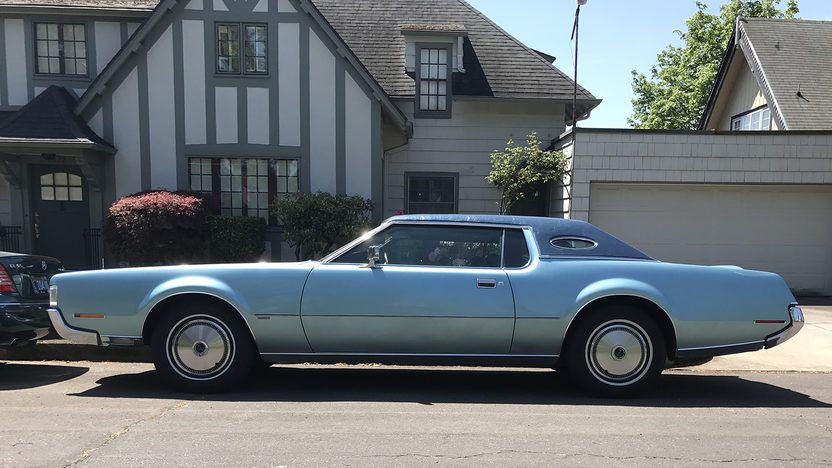 Land yacht lincoln continental blue side view