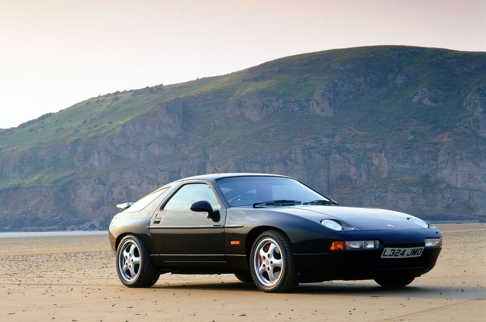 Porsche 928 with mountains in background