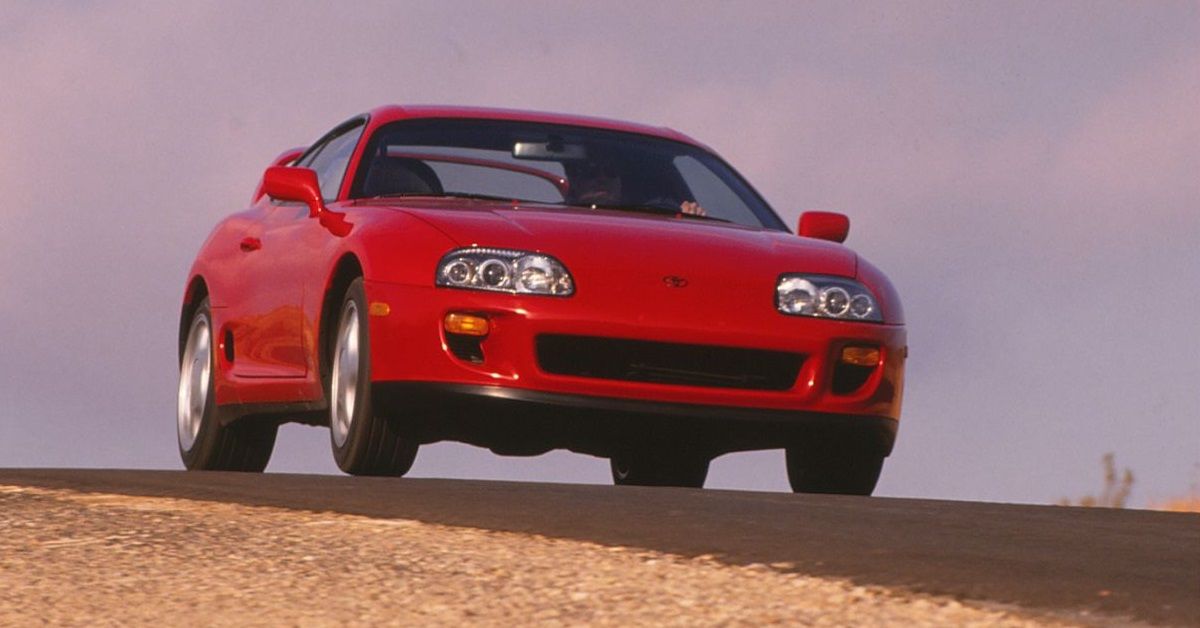 1993 Mkiv Toyota Supra 2JZ on top of hill at sunset