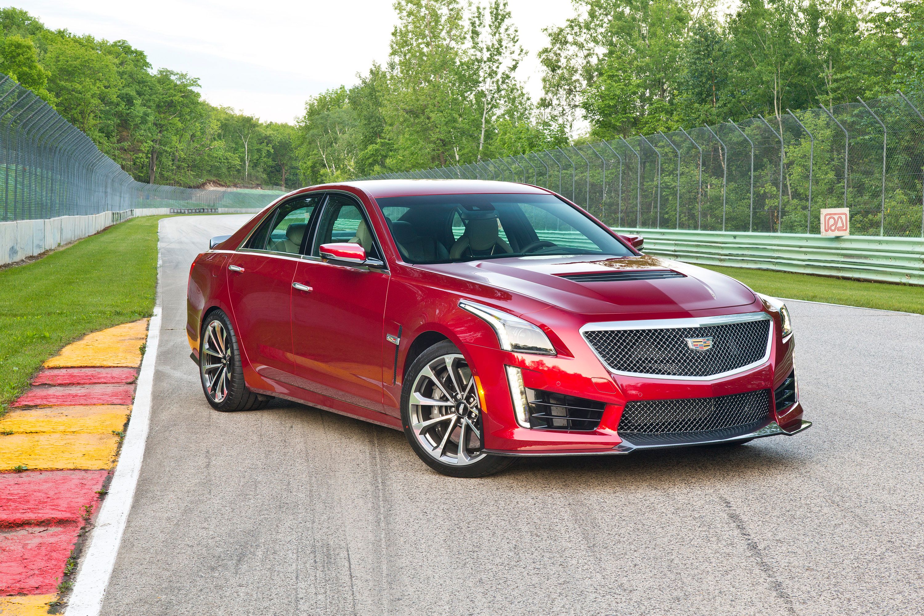 Red Cadillac CTS-V parked on track.