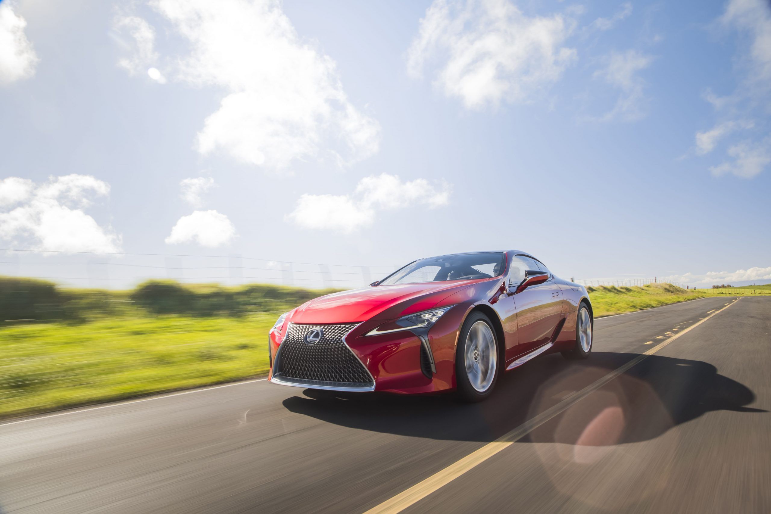 Red Lexus LC500 On The Move Front 3/4 View