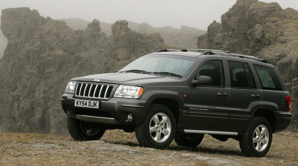 An Image Of A Grey Jeep Grand Cherokee