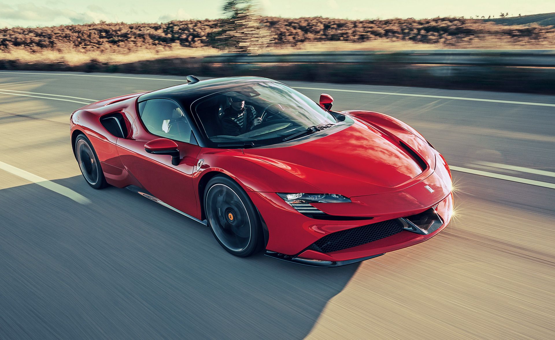 A Red Ferrari In Motion
