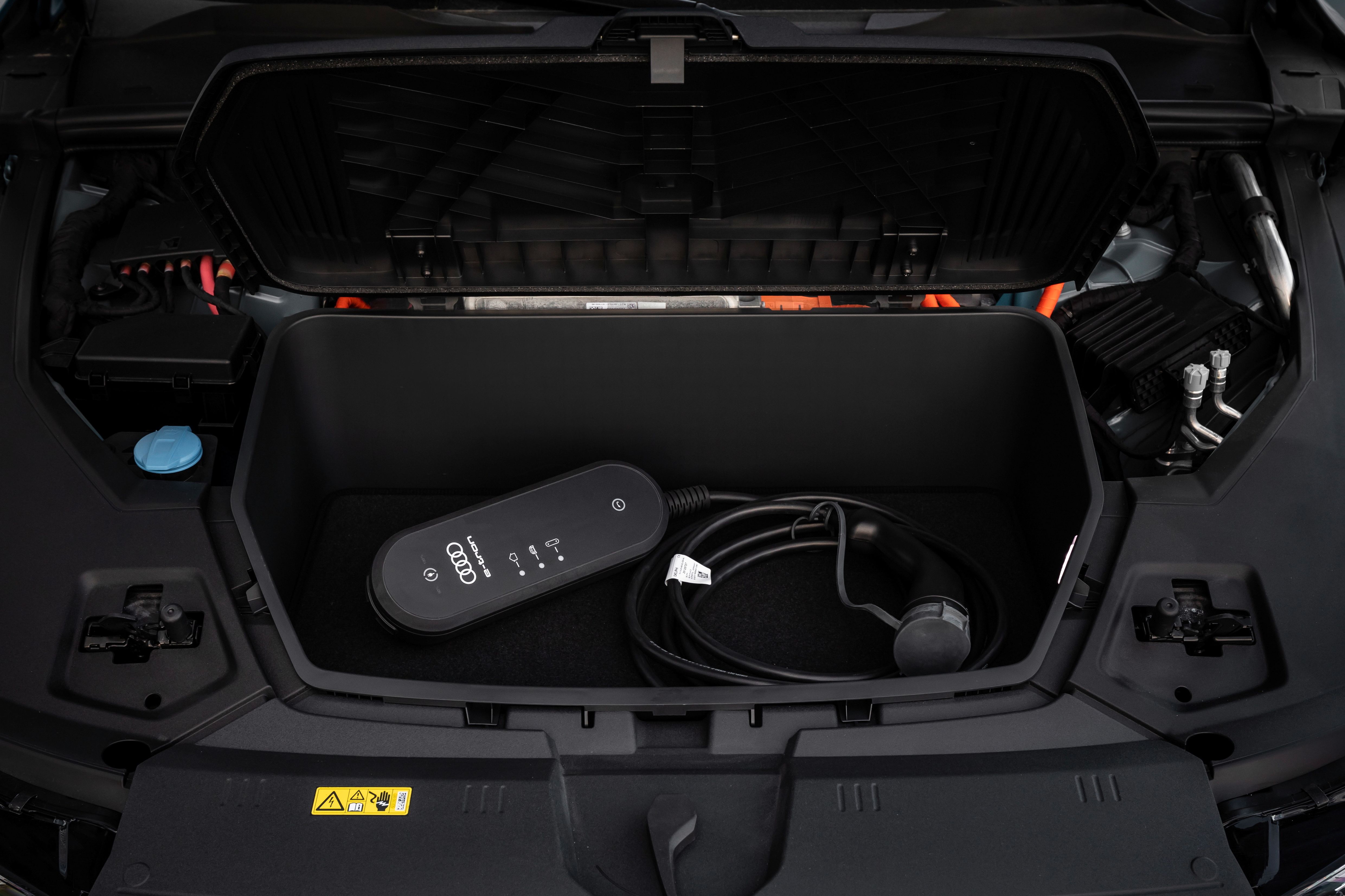 The charging cable in the e-tron's cargo area