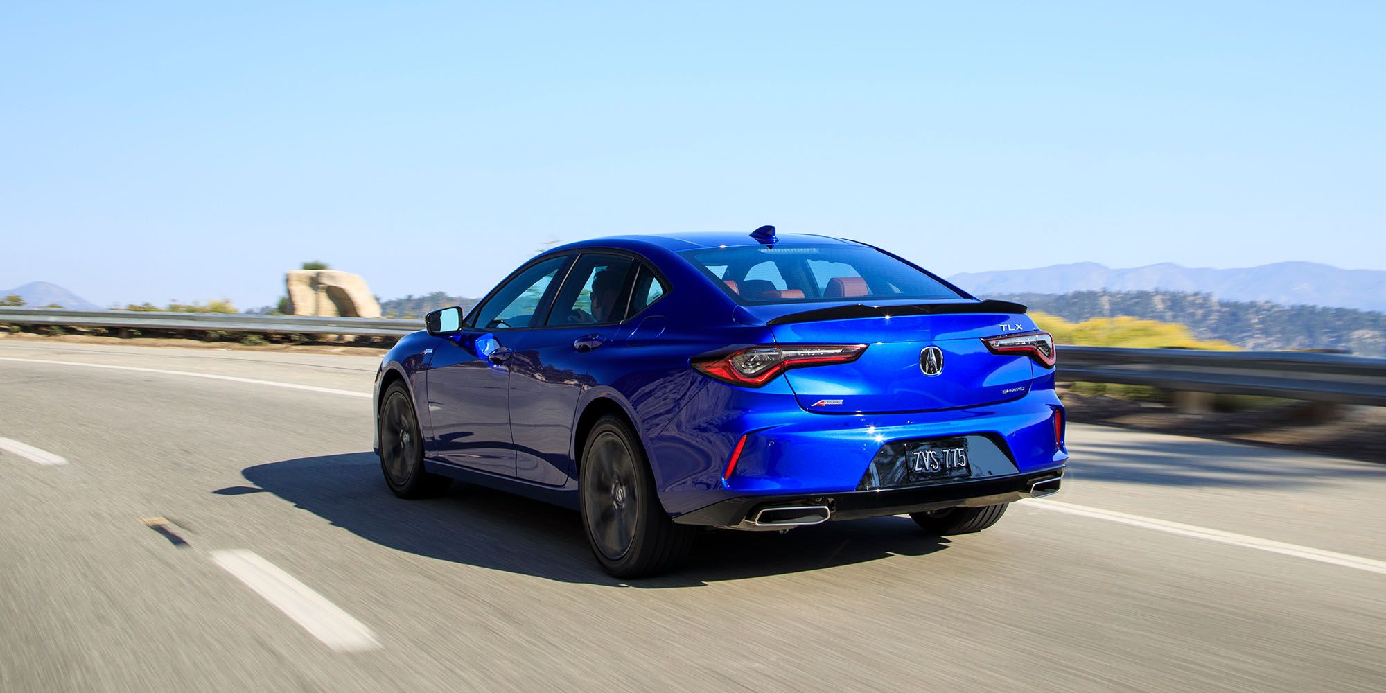 The rear of a blue TLX A-Spec