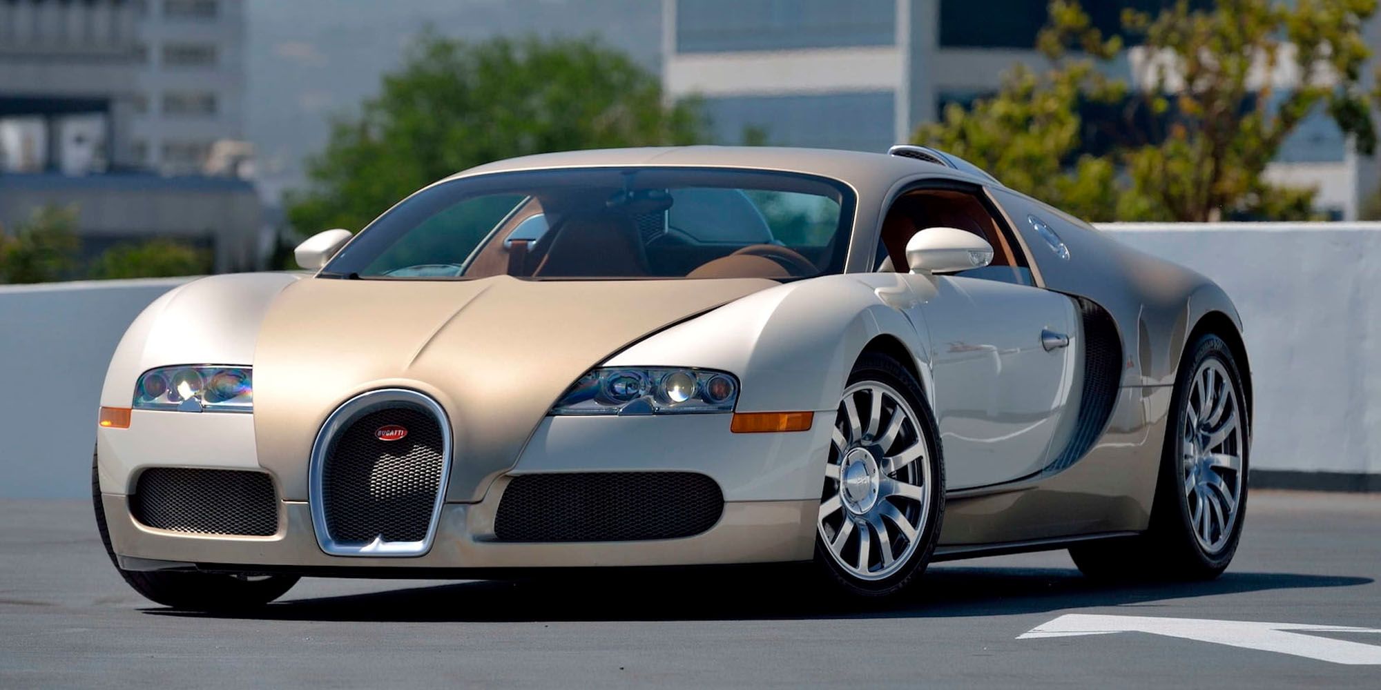 The front of a two-tone gold and white Veyron