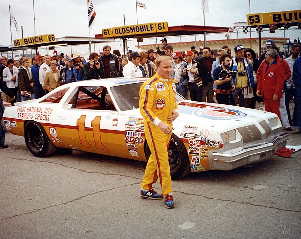 An Image Of Cale Yarborough In An Orange Suit