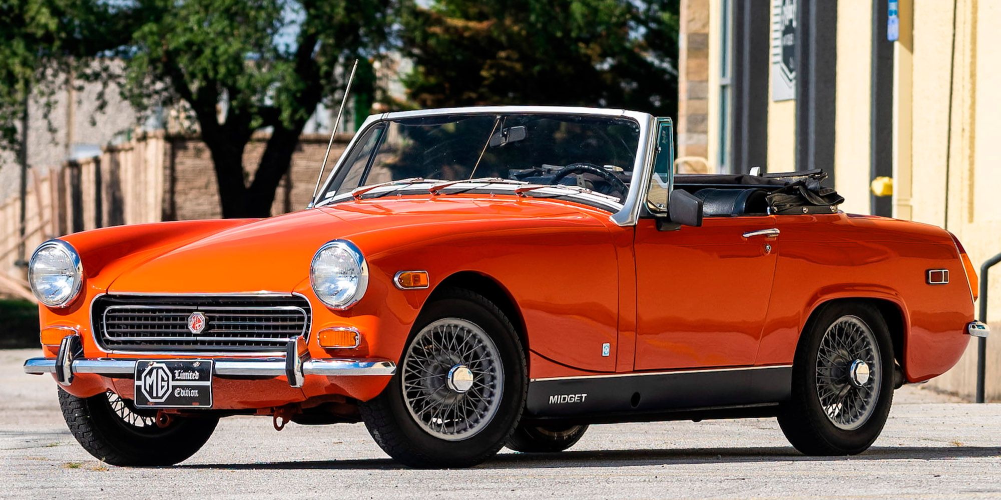 The front of an orange MG Midget