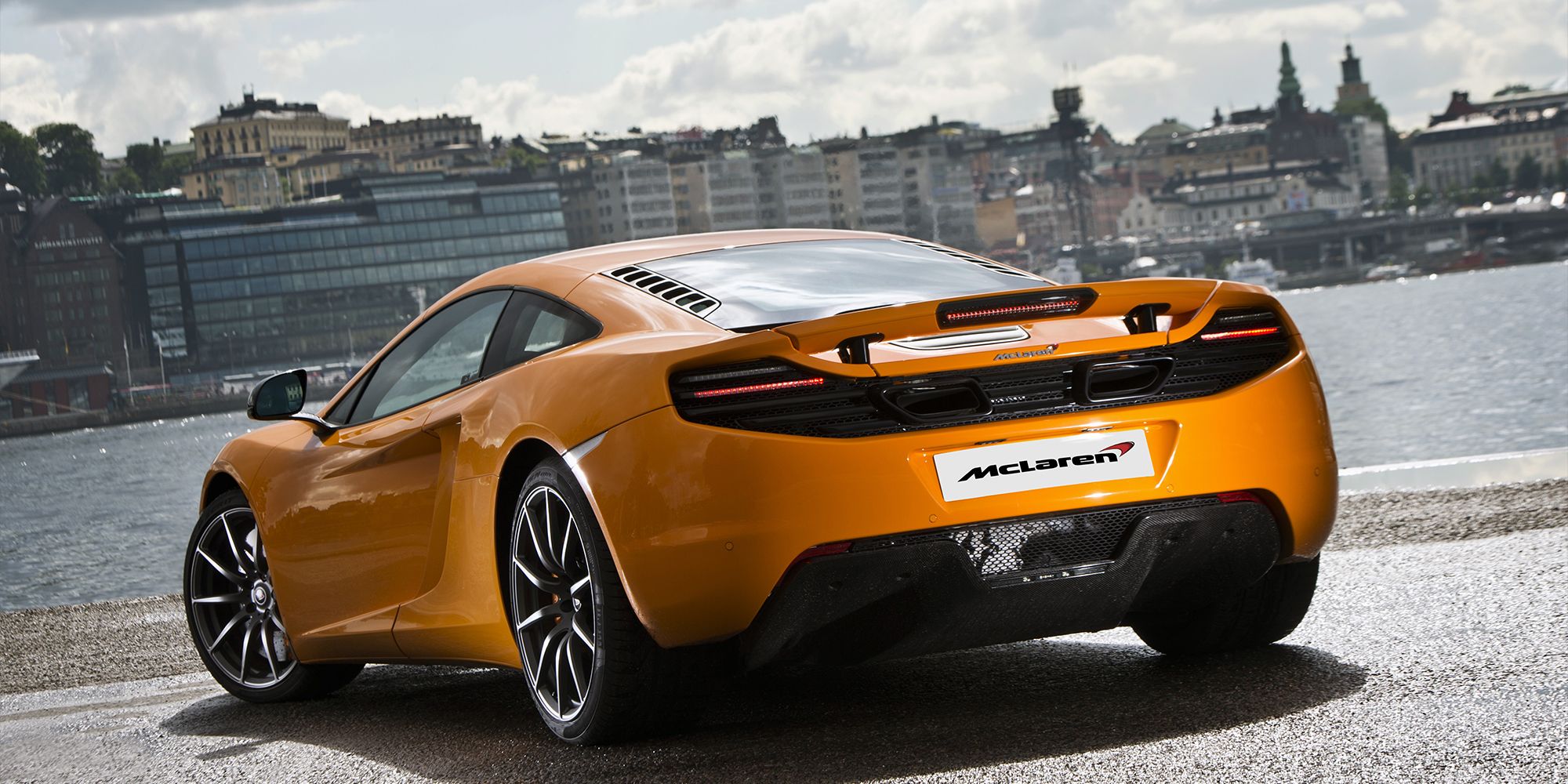 The rear of an orange MP4-12C