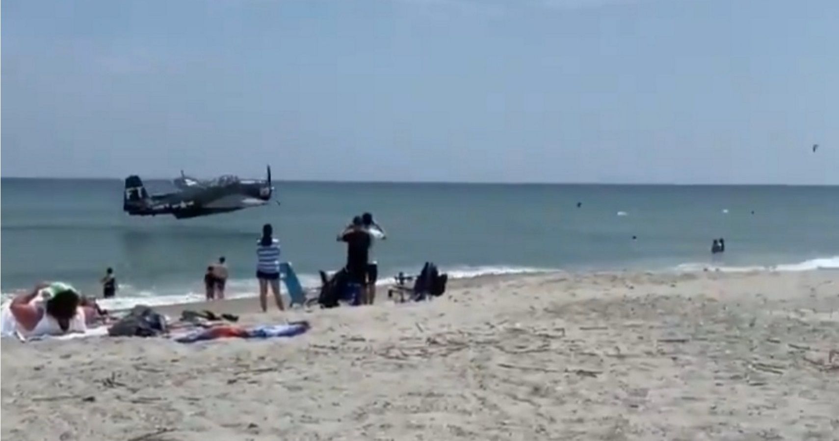 WWIIEra Plane Makes Emergency Ocean Landing Just OffShore Of Beach