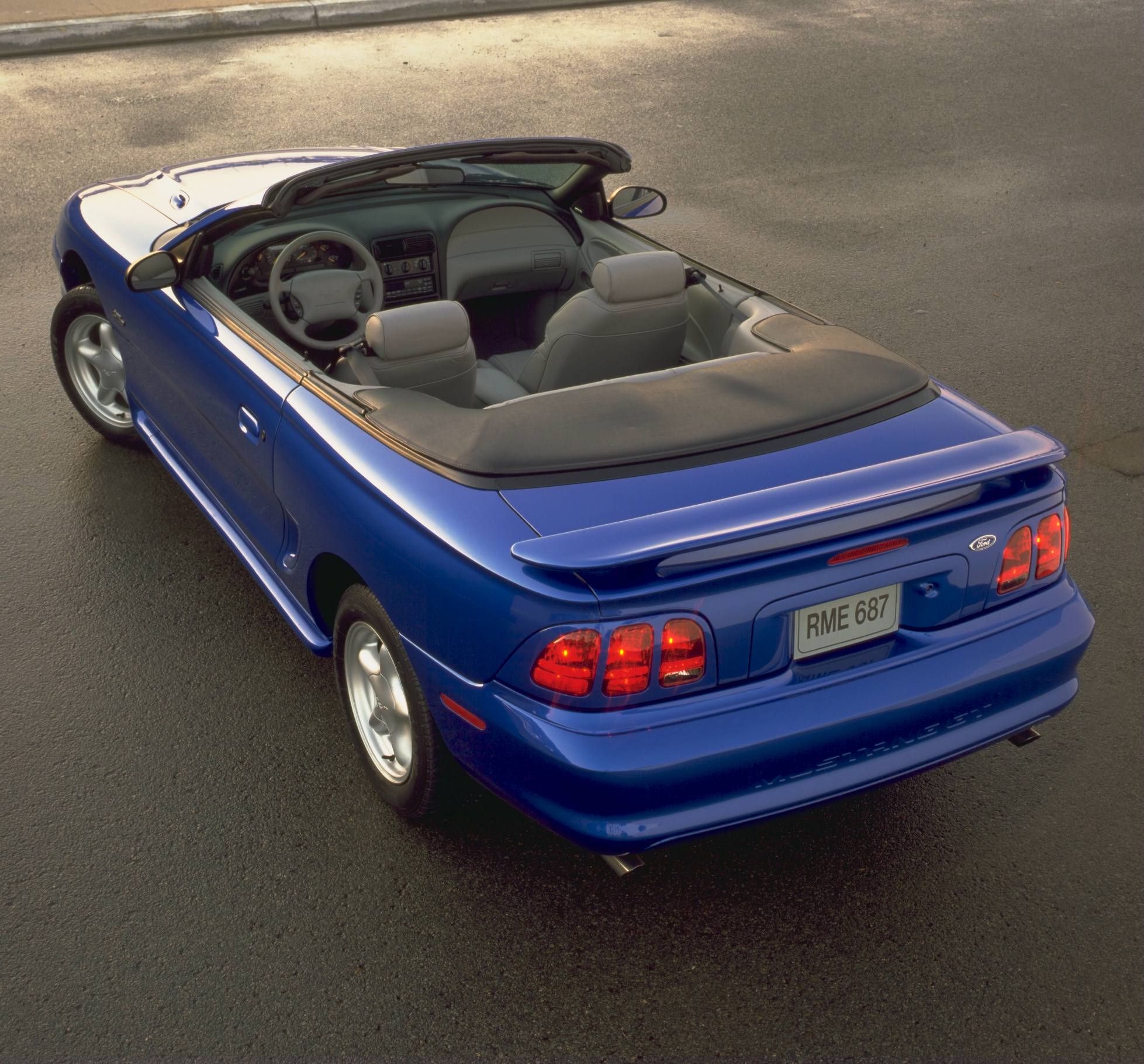 A blue Ford Mustang GT convertible.