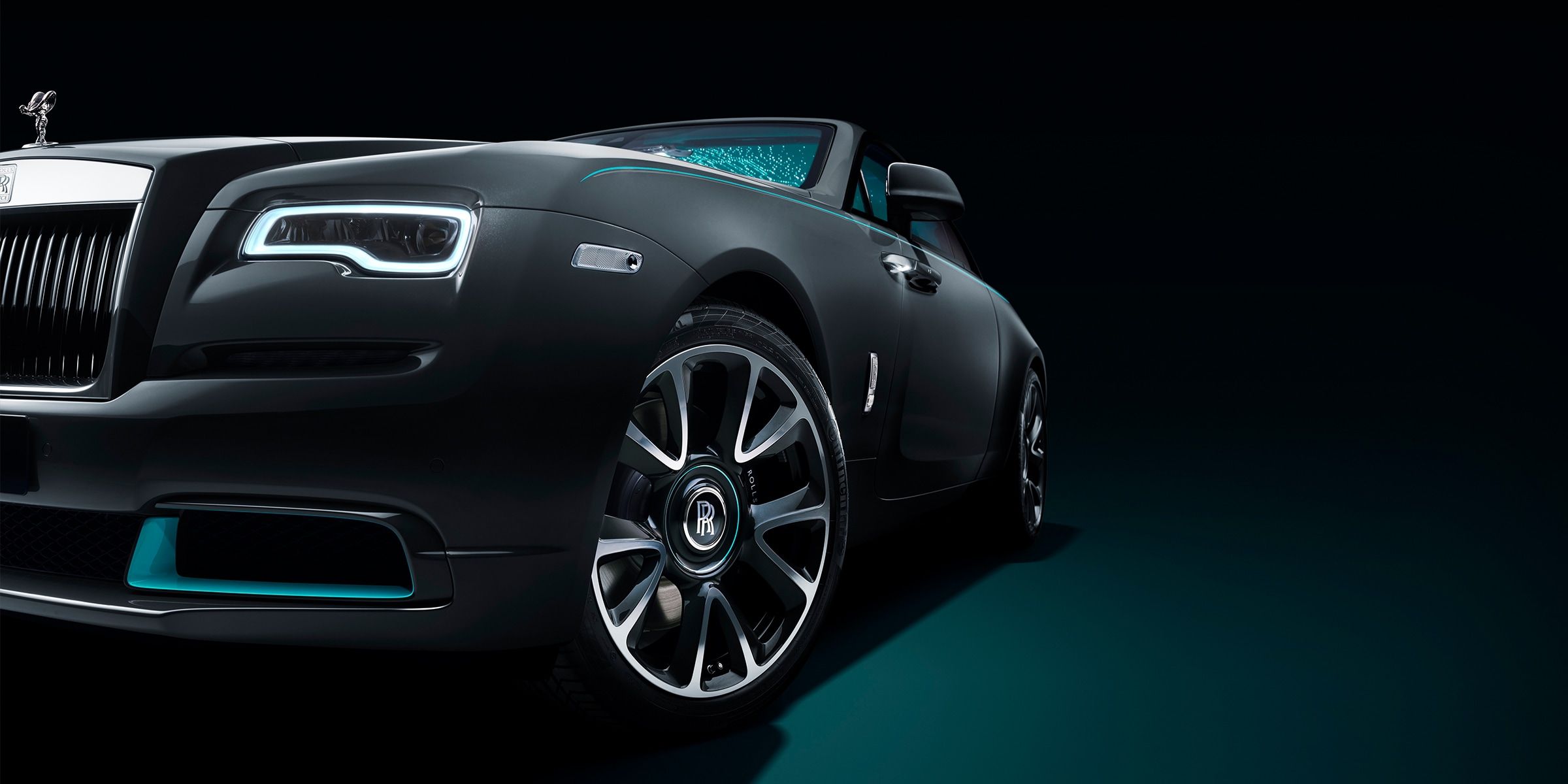 An Image Of A Black Rolls Royce Wraith