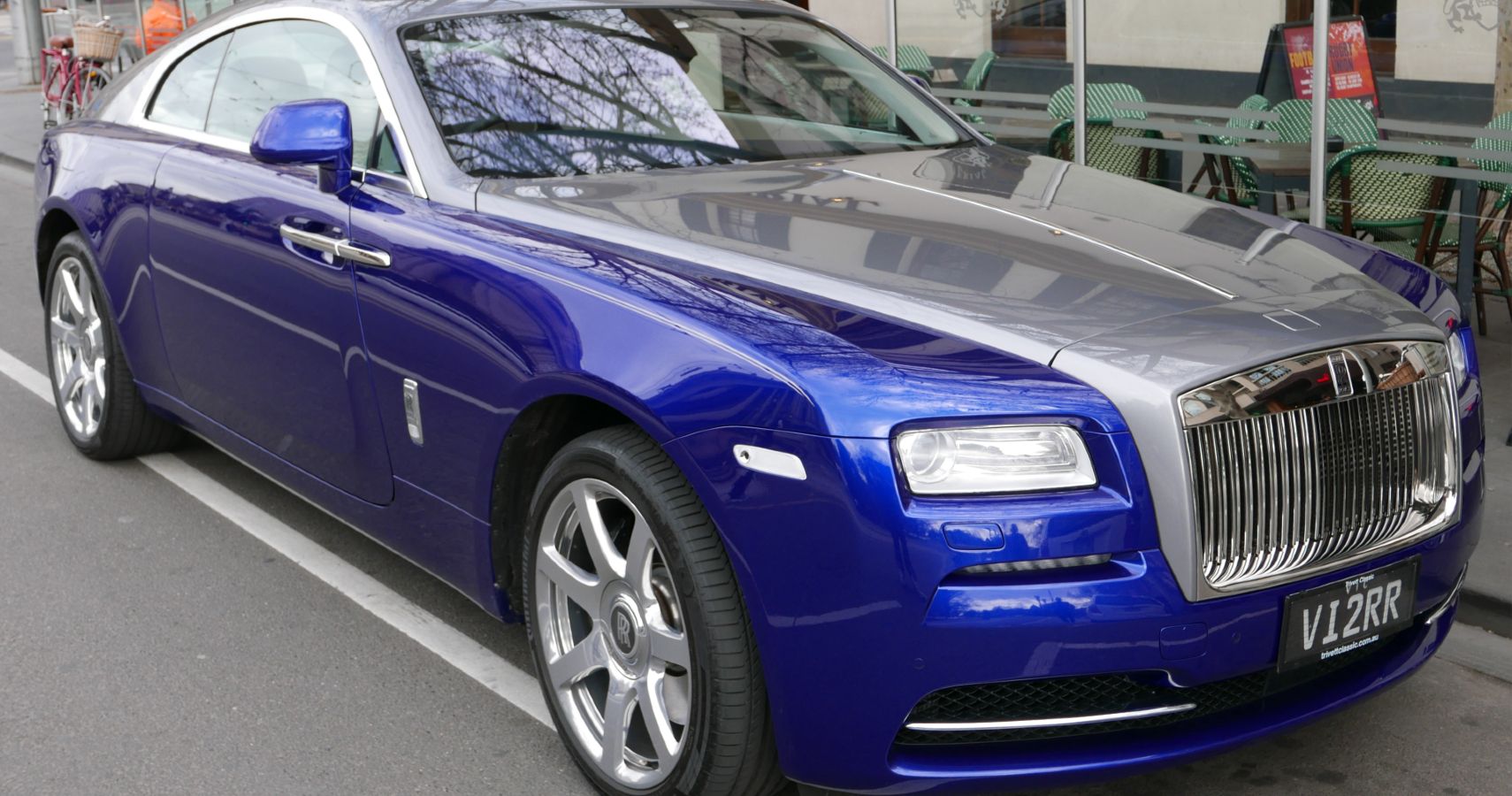 An Image Of A Royal Blue Rolls Royce Wraith