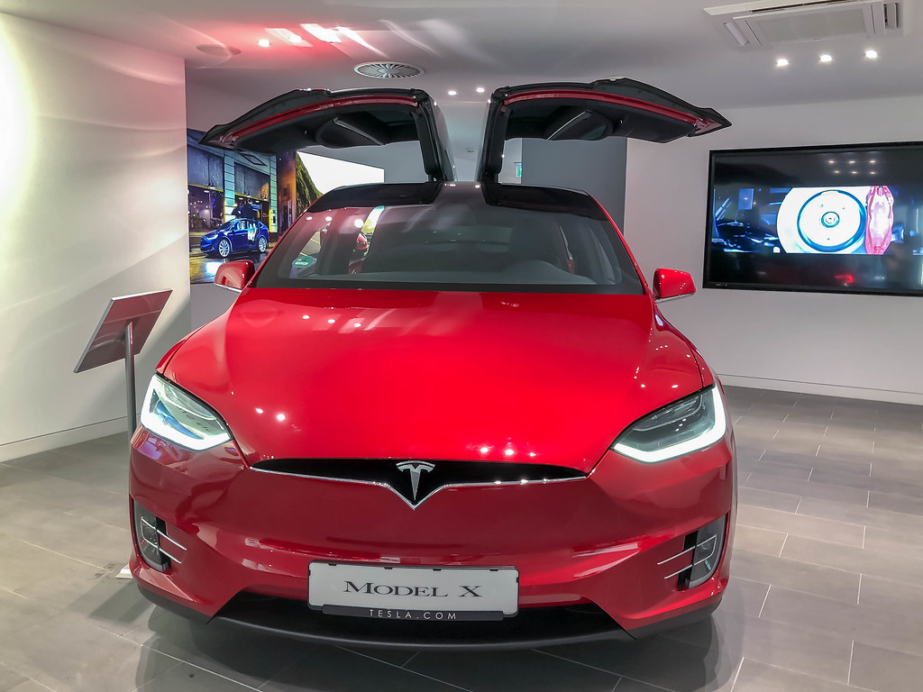 Cherry-Red Tesla Model X in a Showroom