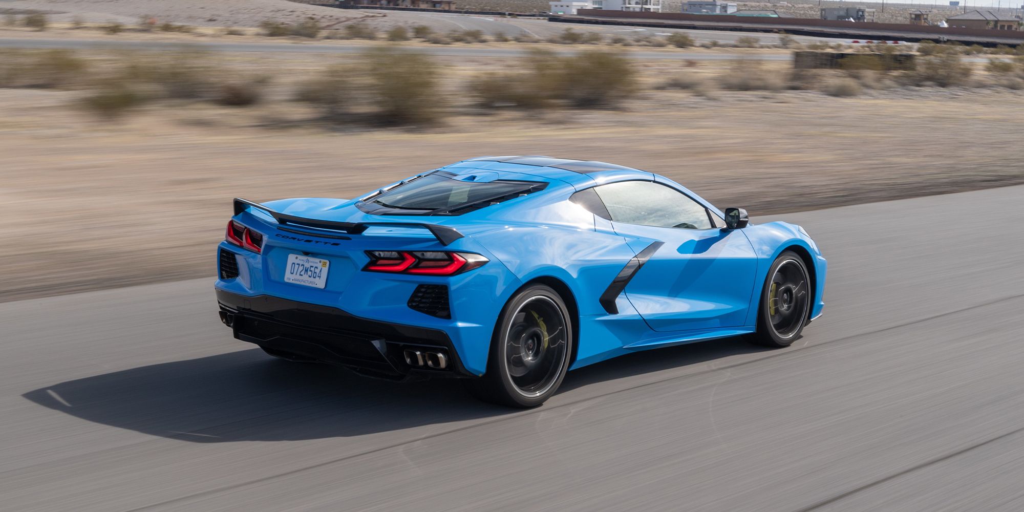 The rear of a blue C8 Corvette