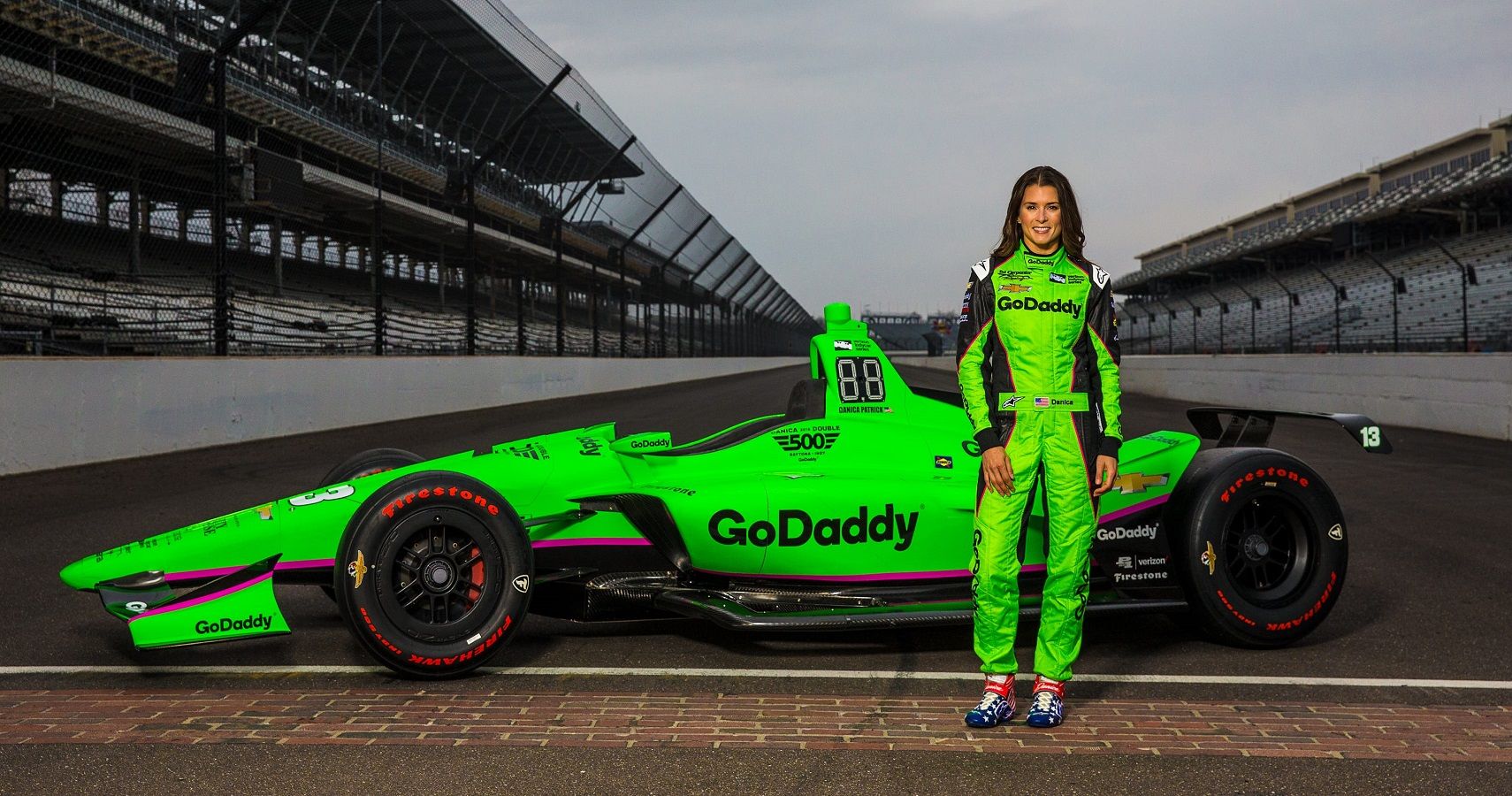 Danica Patrick posing with her racing car