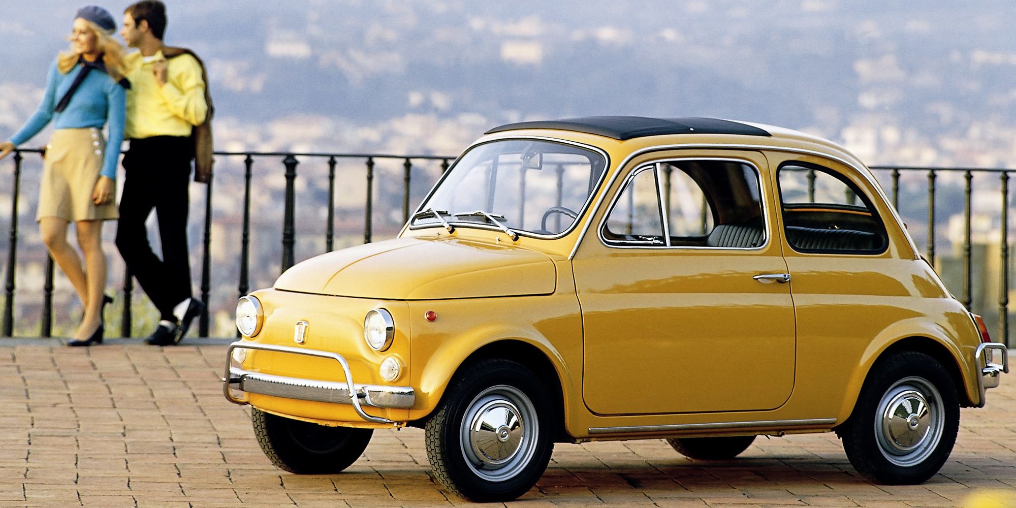 A yellow Fiat 500
