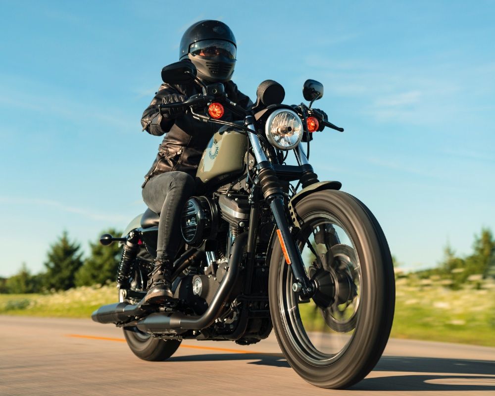 A rider on a 2021 Harley-Davidson Iron 883.