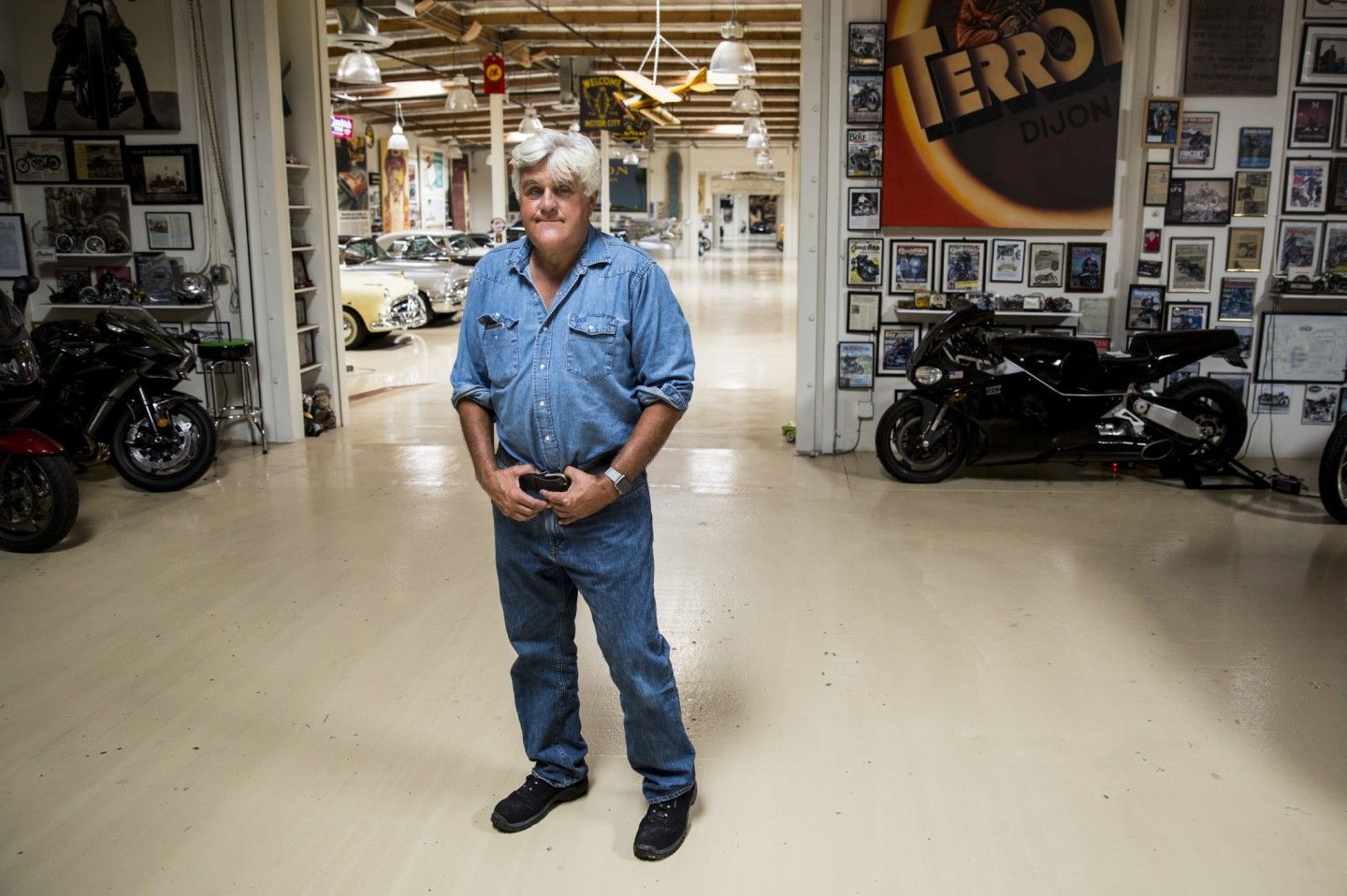 Jay Leno standing in his garage