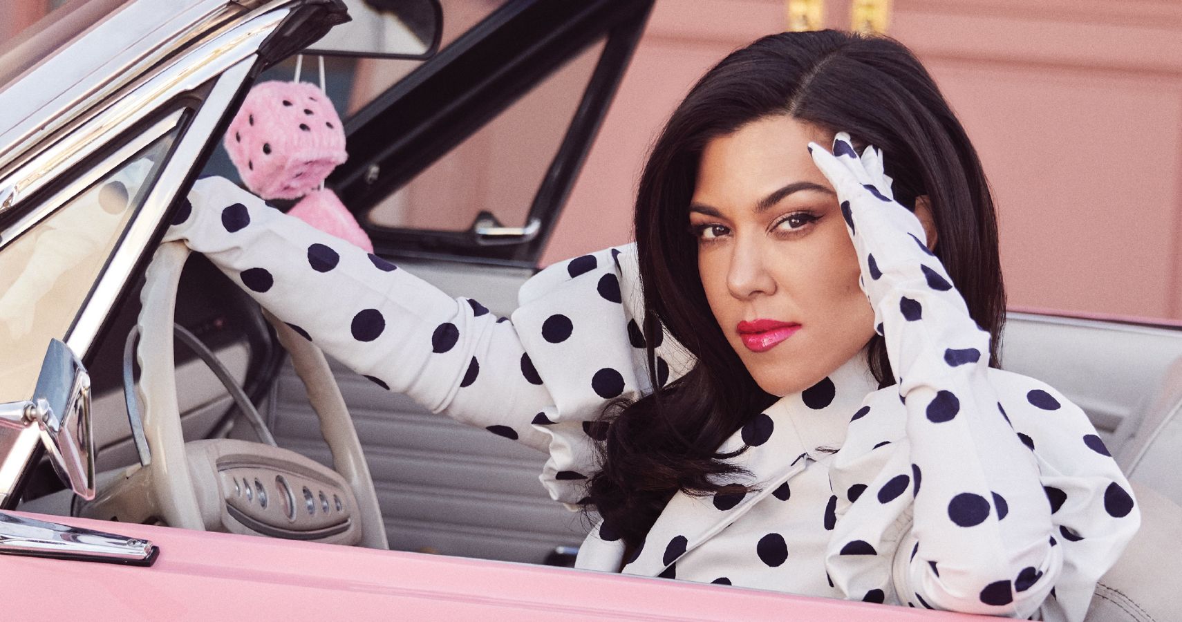 Kourtney Kardashian Posing In A PinkCar