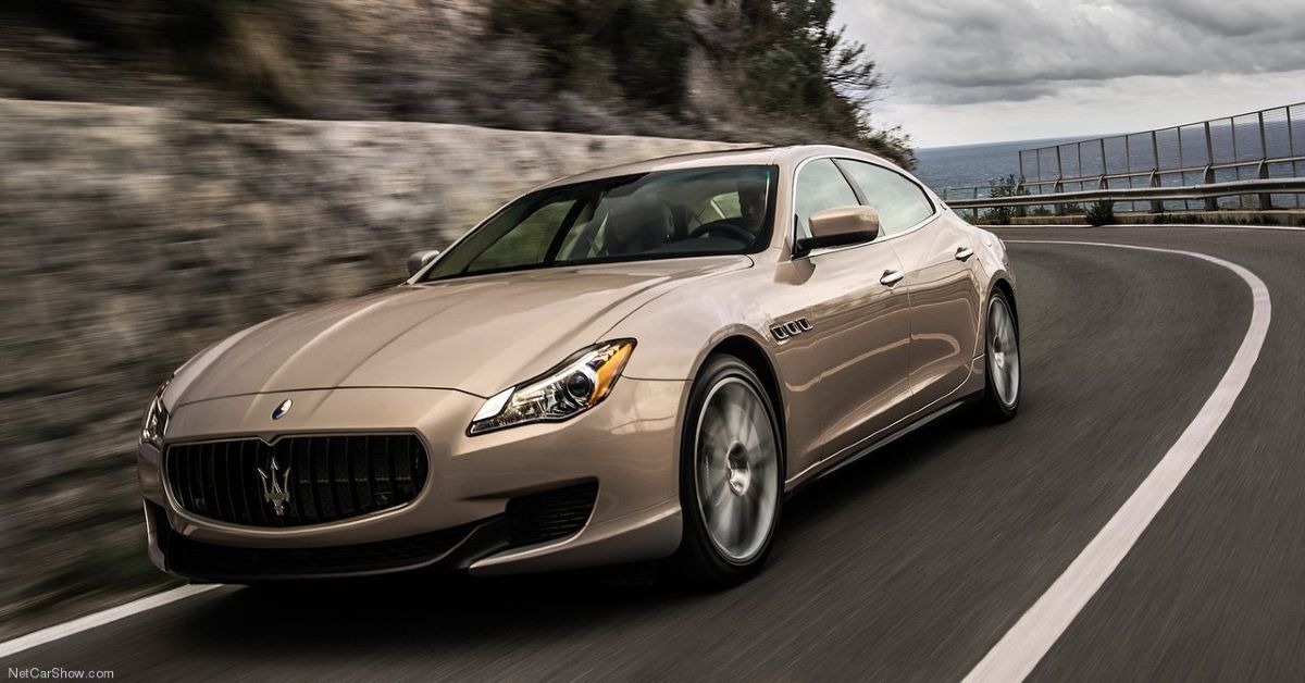 Gold Maserati-Quattroporte Running Down The Road