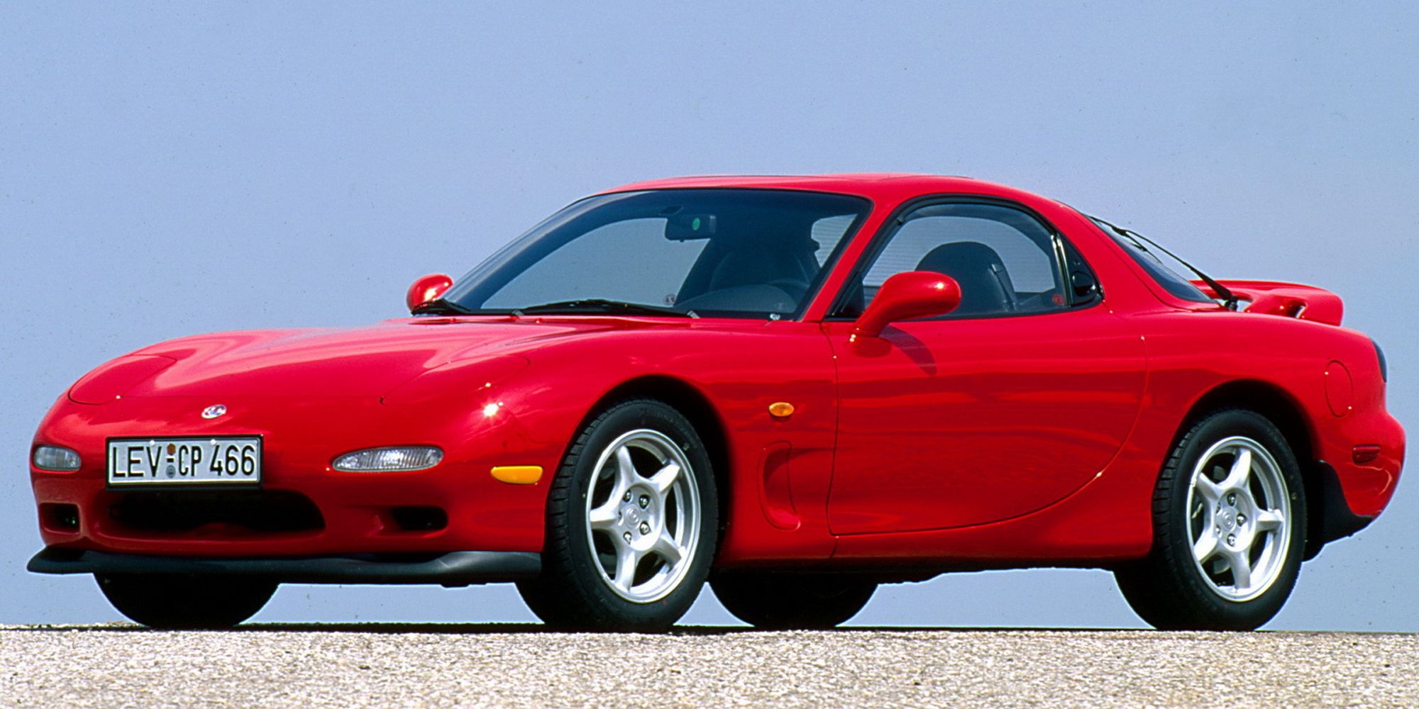 Front 3/4 view of a red FD RX-7