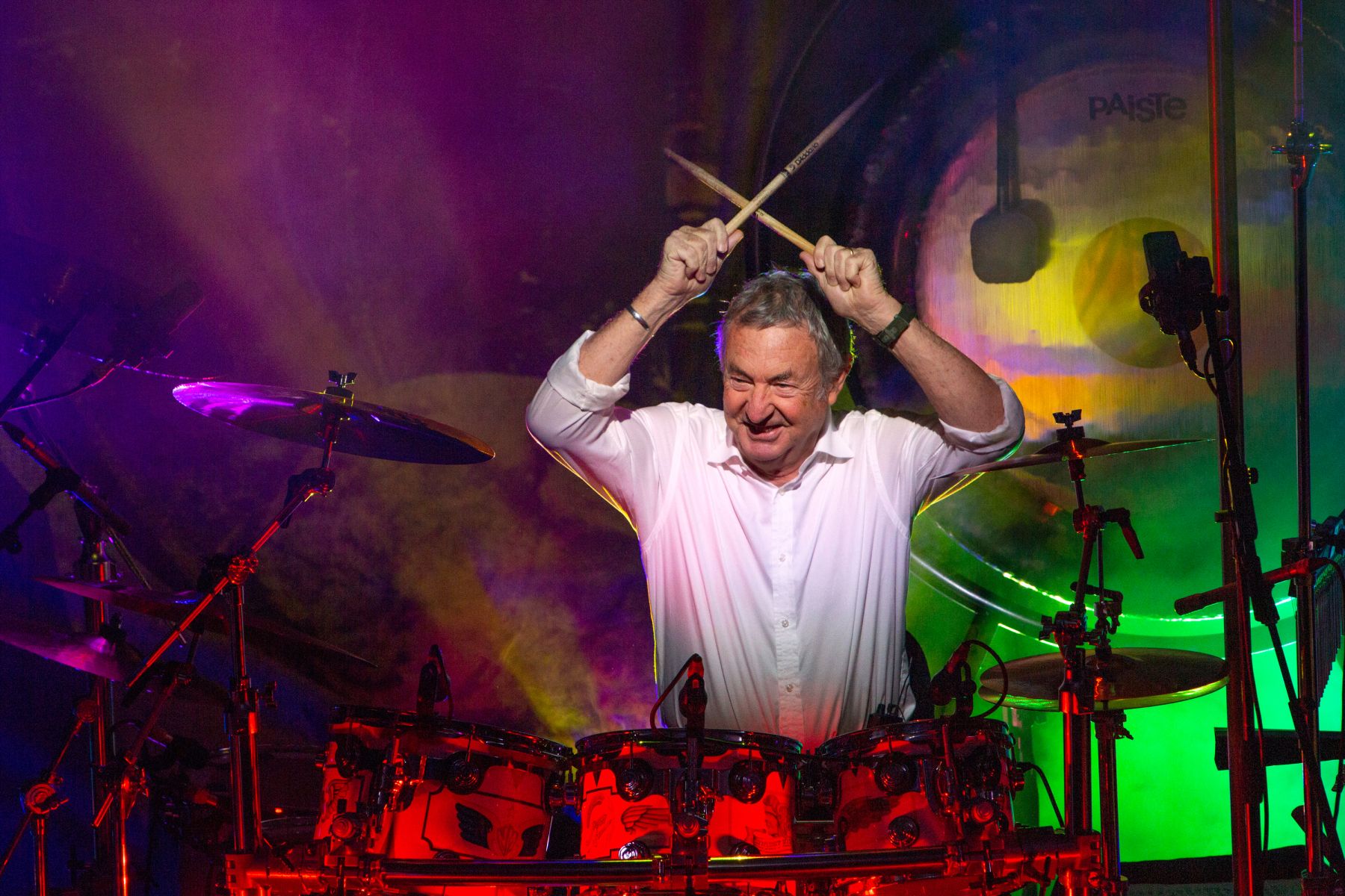Nick Mason, drums, darkness lit by stage lights