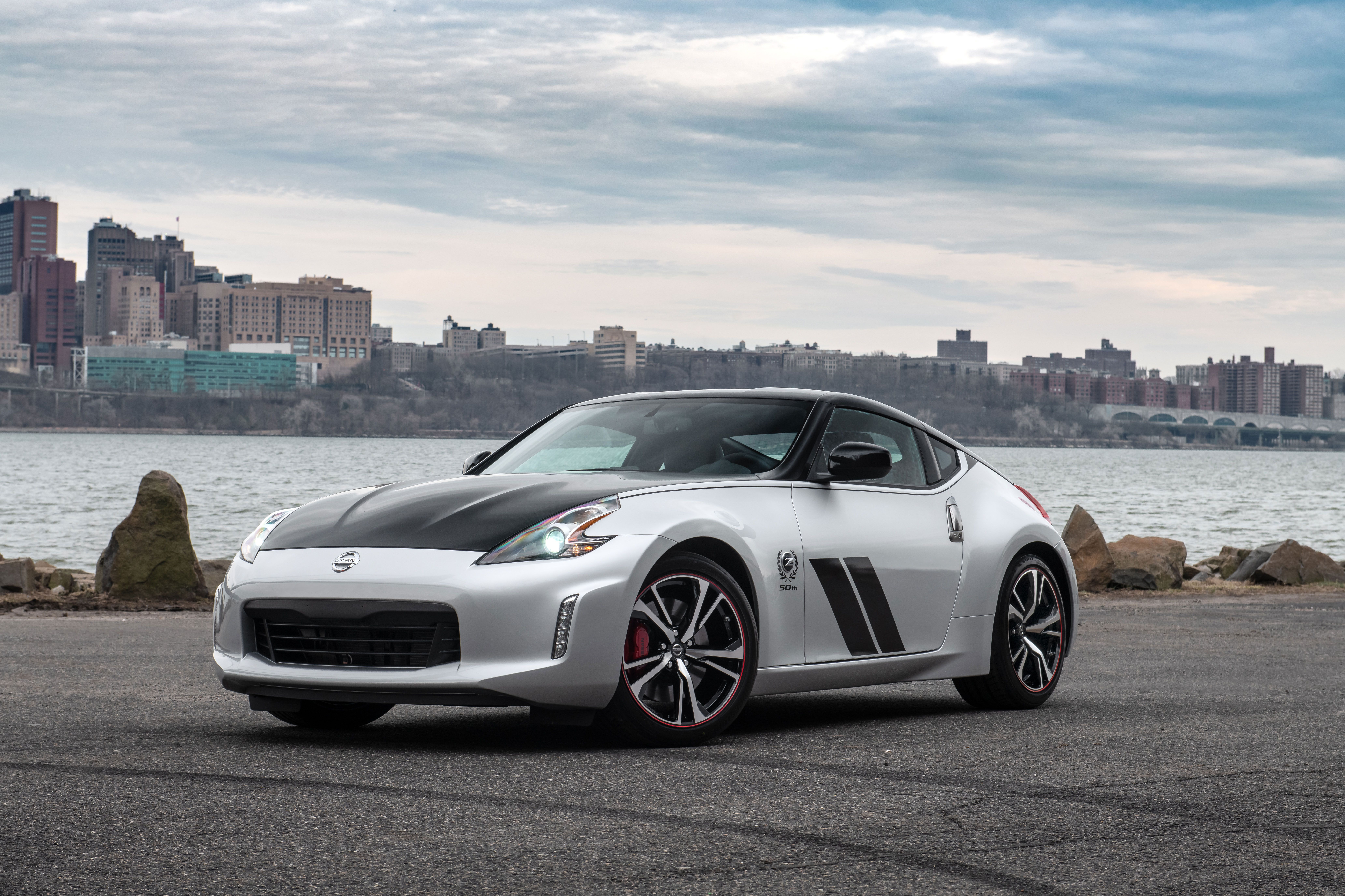 The exterior of the 370Z 50th Anniversary Edition mimics the livery of the original BRE race car and is available in two different paint schemes: white with red accents, or silver with black accents.