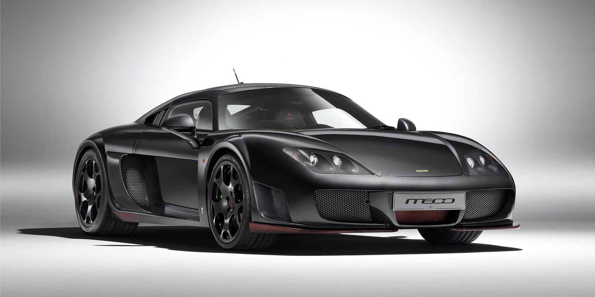 The front of a black Noble M600 with red accents