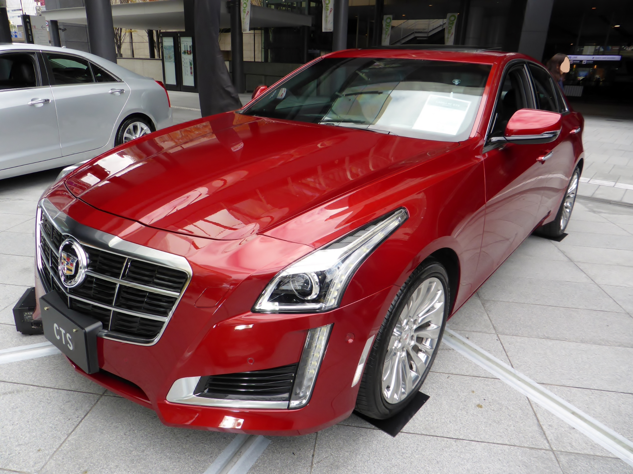 Red Cadillac CTS Outside a Building