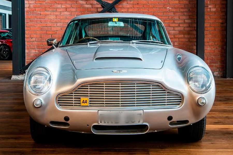 An Image Of A 1964 Aston Martin DB5 In A Showroom