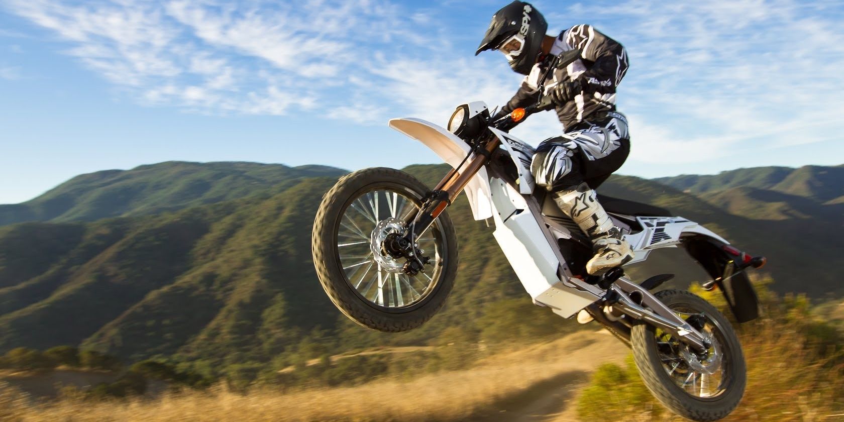A Rider On A Zero Motorcycle Performing A Jump