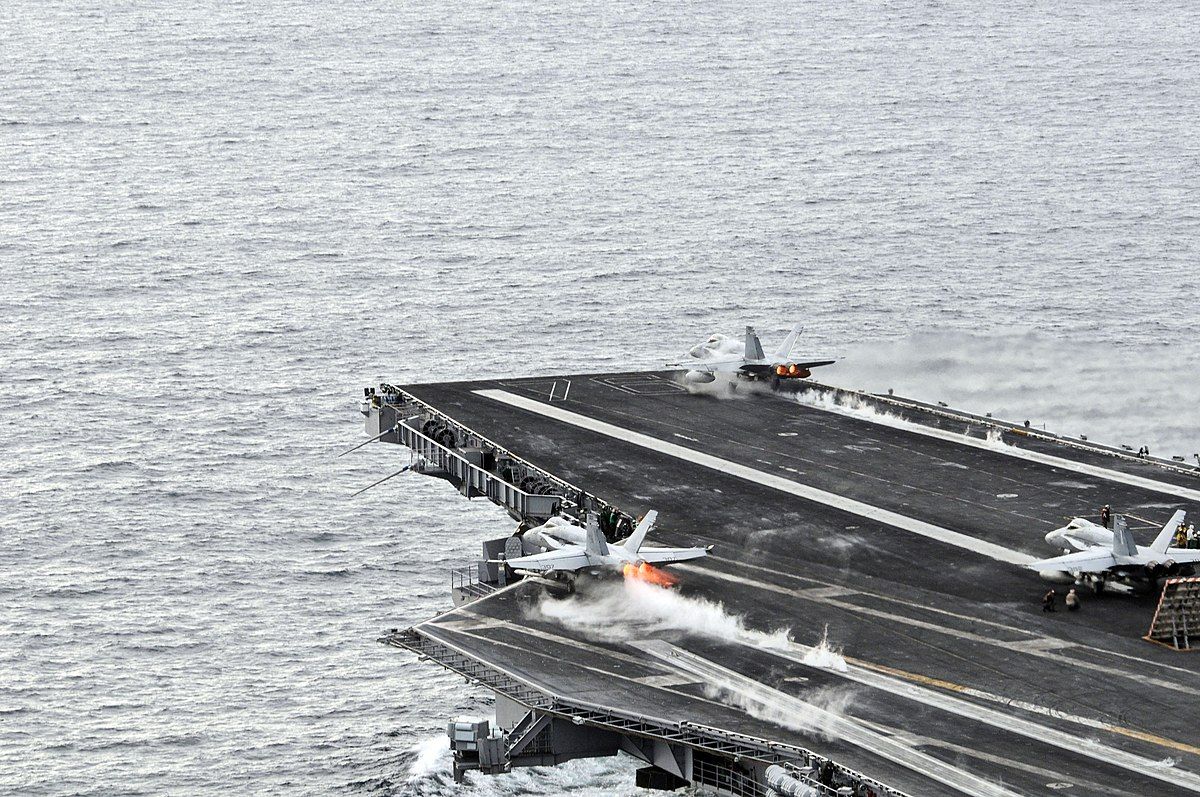 1200px-US_Navy_081124-N-3659B-305_F-A-18C_Hornets_launch_from_the_Nimitz-class_aircraft_carrier_USS_Ronald_Reagan_(CVN_76)