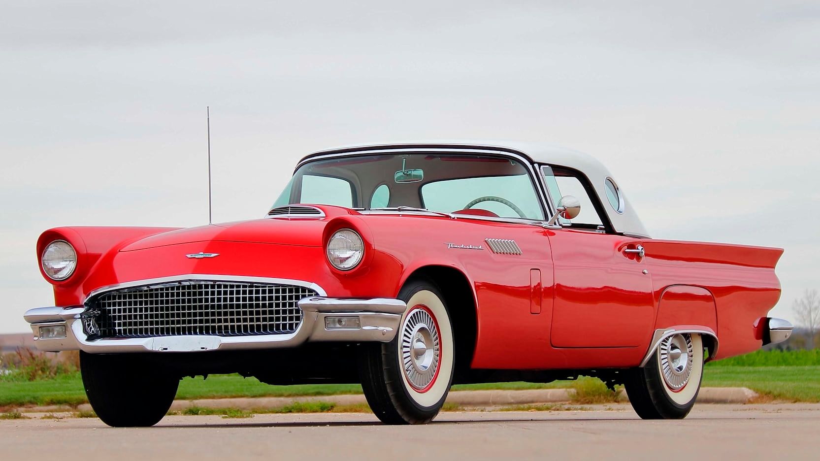 1957 Ford Thunderbird, red with whitewall tyres