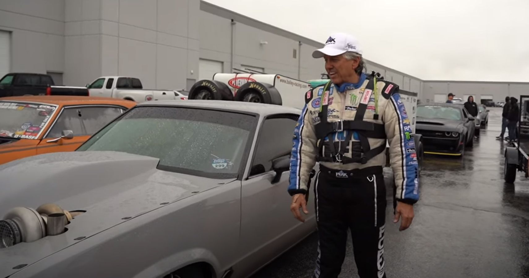 Drag racing legend John Legend at a garage parking lot