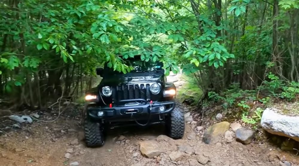 Jeep Gladiator 6X6 climbs up rugged hill