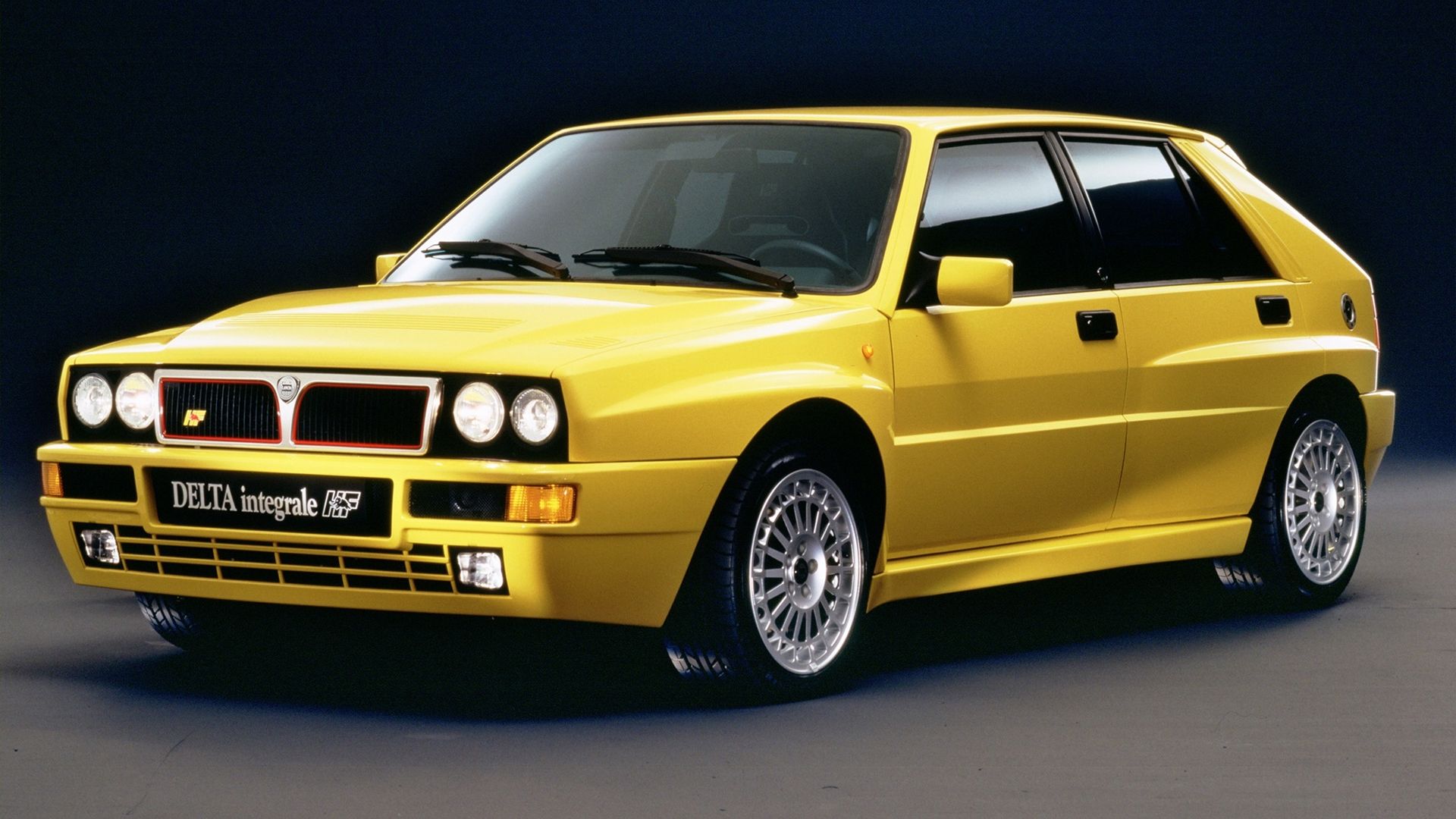 The front of a yellow Delta HF Integrale