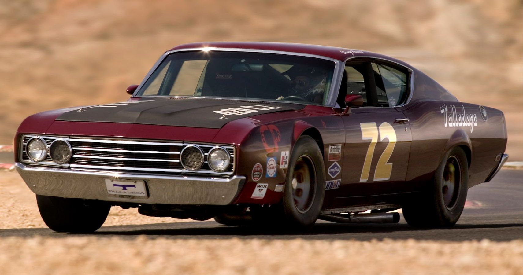 Maroon 1969 Ford Torino Talladega seen racing on track