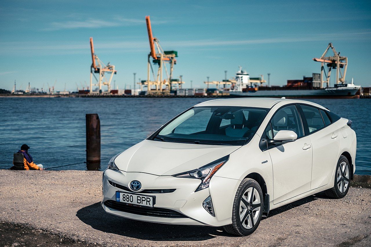 White Toyota Prius by water
