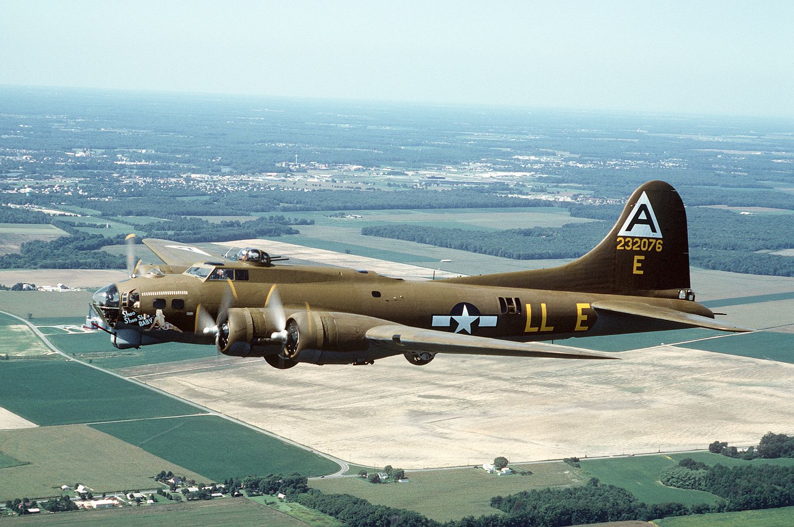 left side view of restored B-17 G in flight