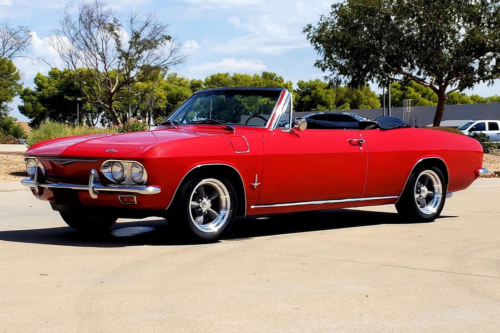 1965 Chevrolet Corvair Monza Convertible, red with torq thrust rims, from Barrett-Jackson