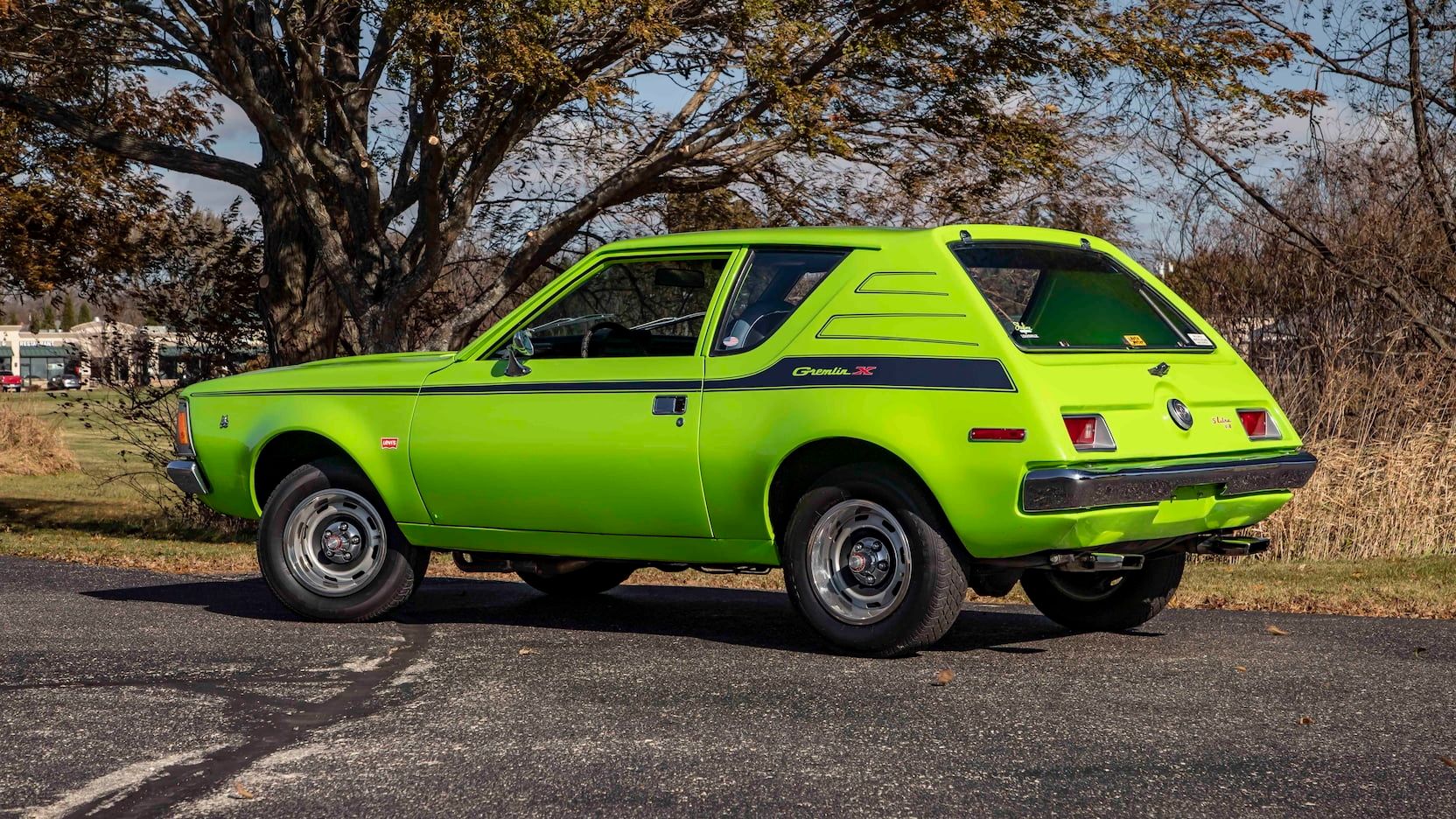 1972 AMC Gremlin X, green with black stripe, side, quarter, Mecum 