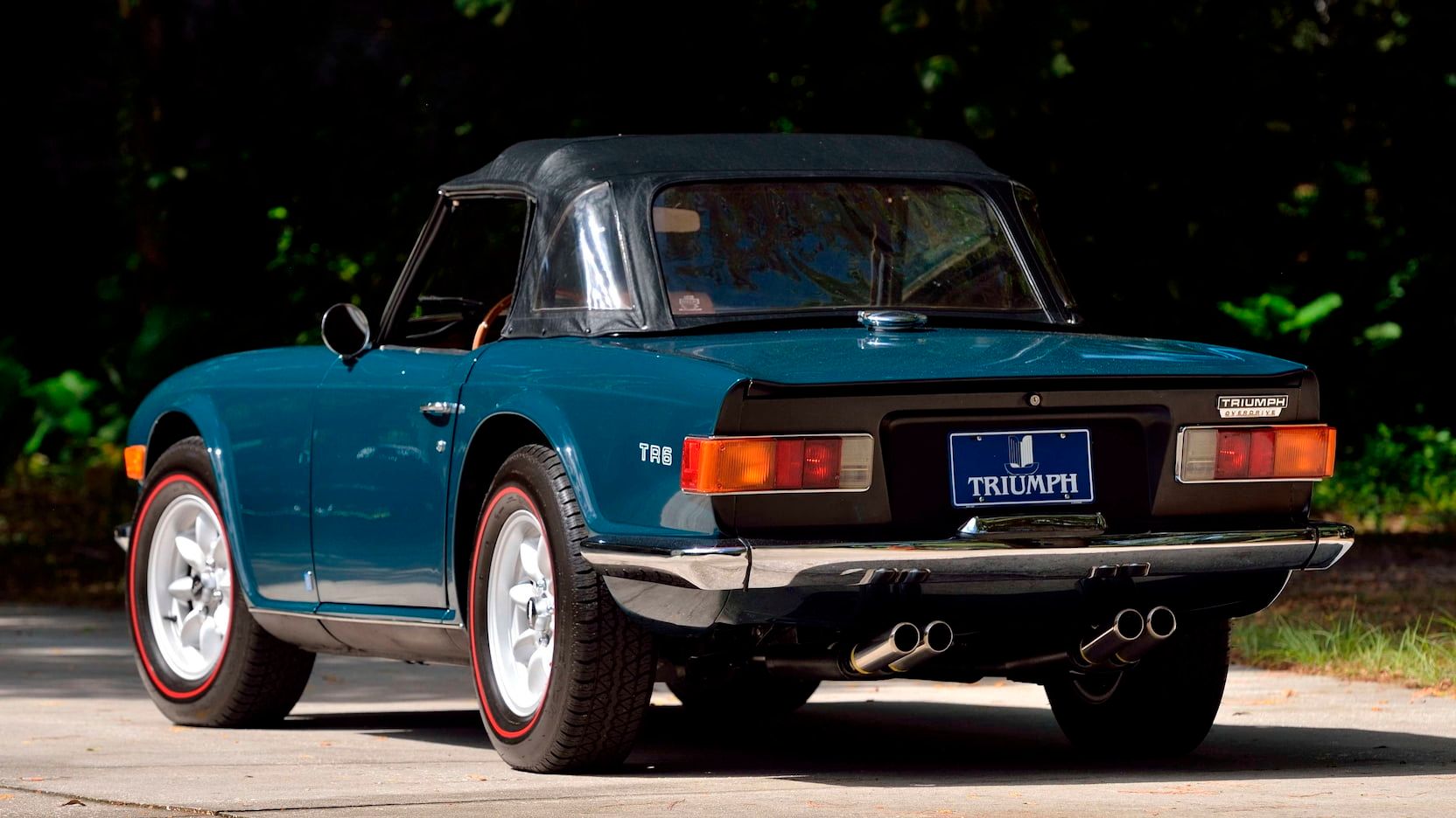 1972 Triumph TR6 parked with its roof up