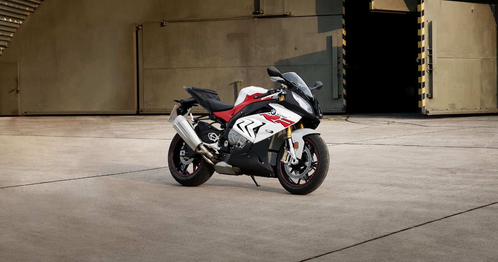 A Red And White BMW S1000RR On The Street