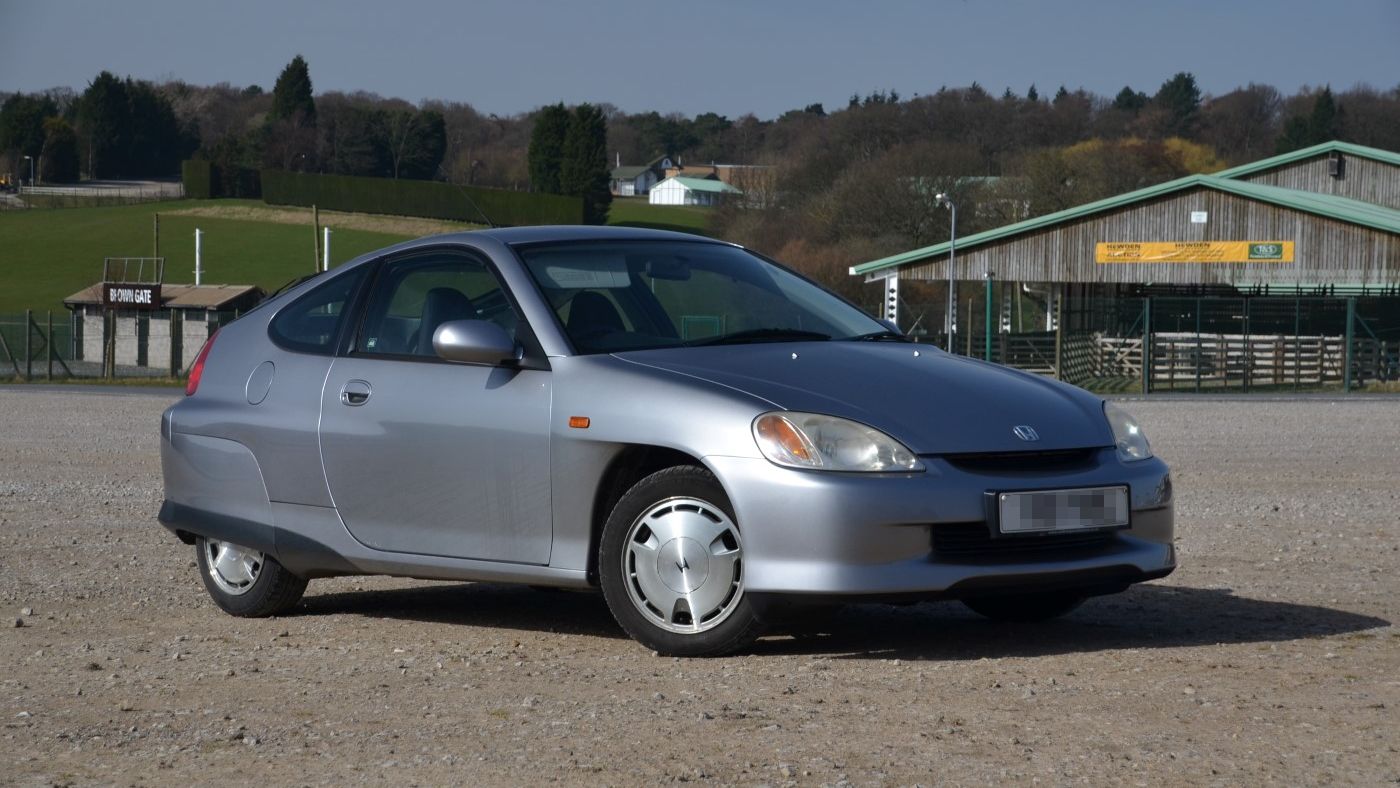 An Image Of A Silver 1999 Honda Insight